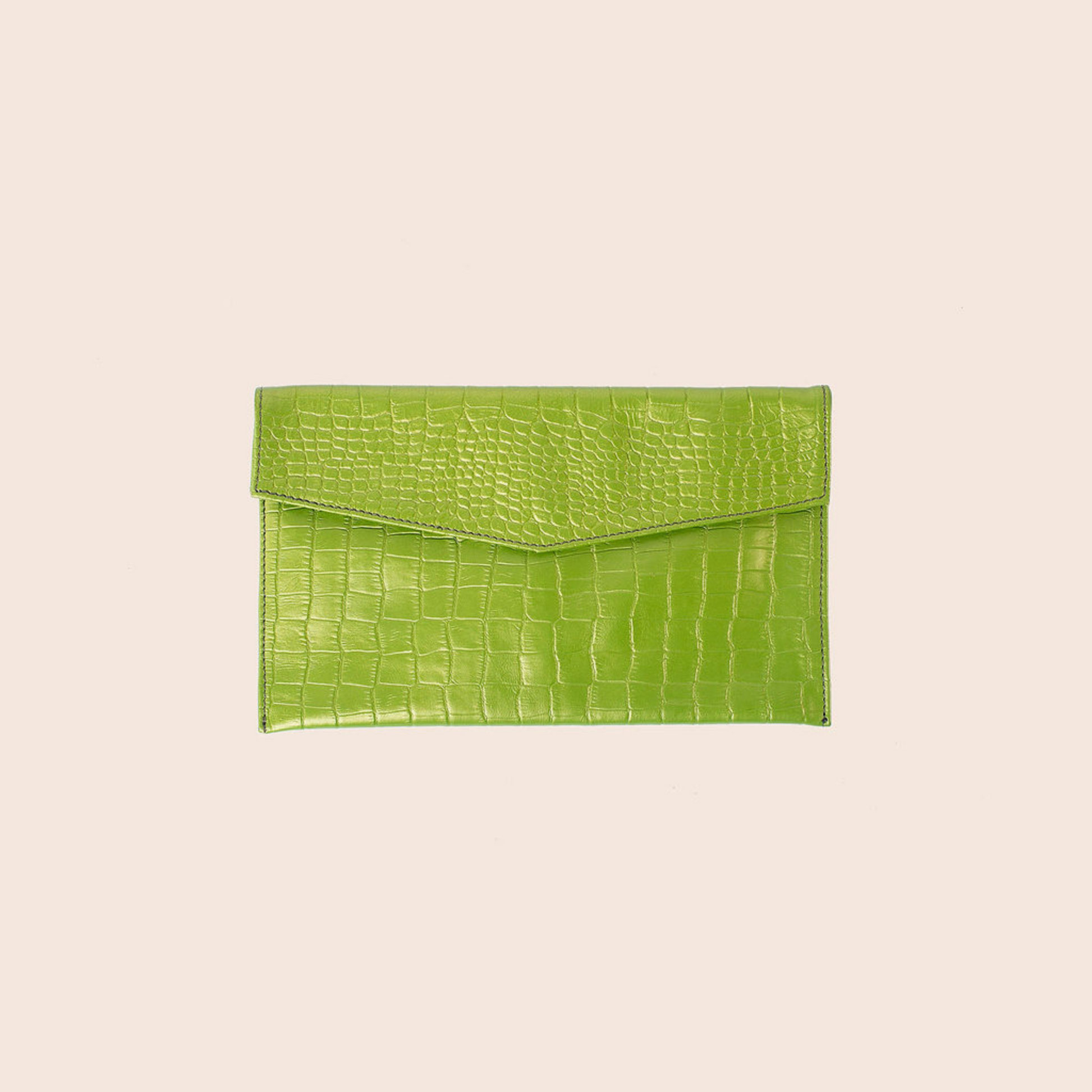 Envelope clutch in green crocodile print leather