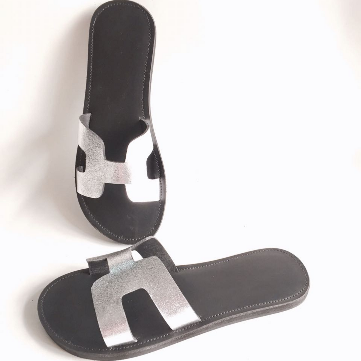 Ceto sandals in black smooth leather with silver foil upper.