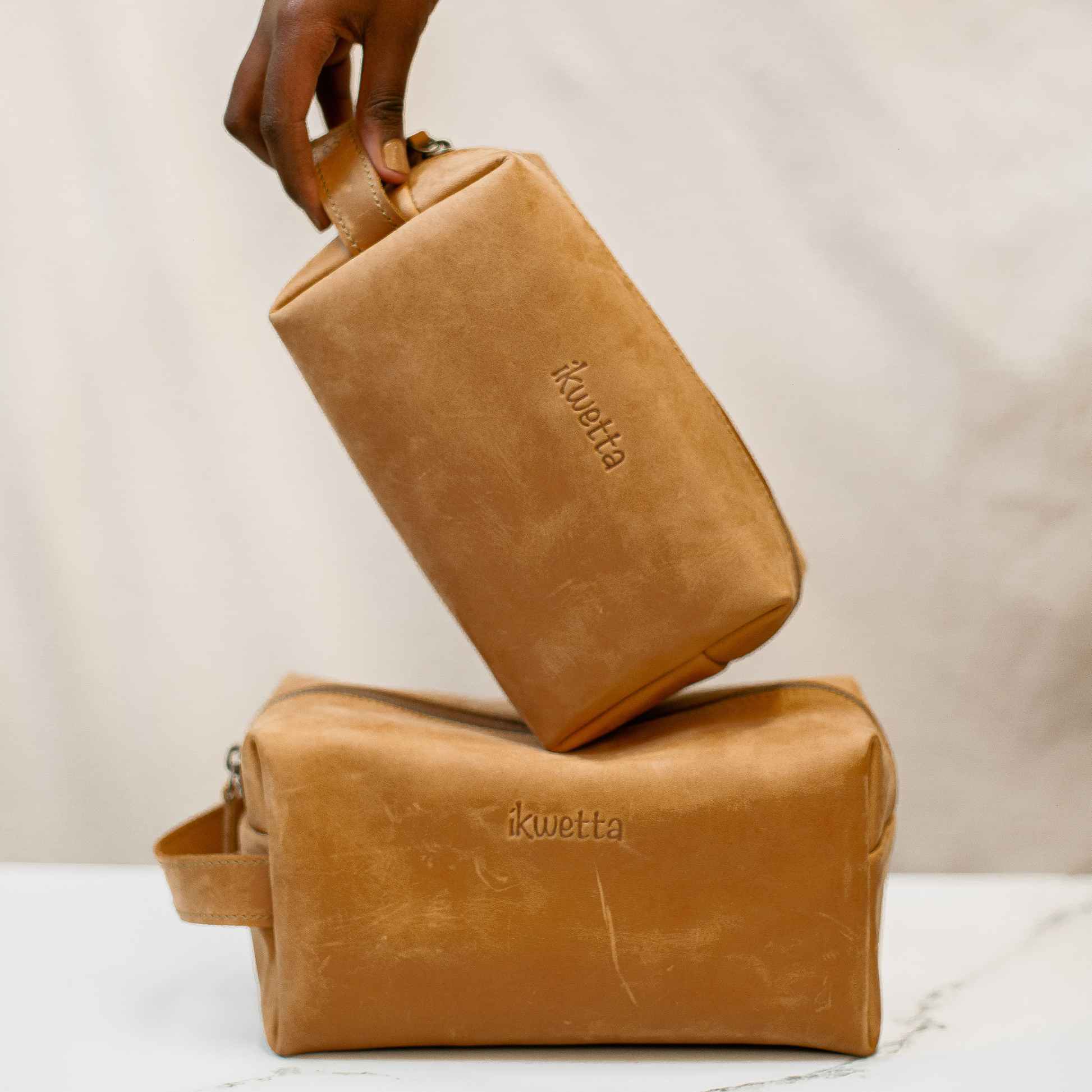 Travel case in tan oil pull up leather